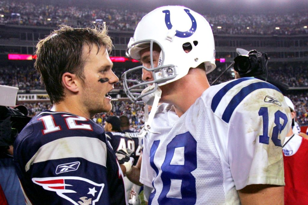 ** FILE ** New England Patriots quarterback Tom Brady, left, chats with Indianapolis Colts quarterback Peyton Manning after the Patriots beat the Colts 27-24 on Sept. 9, 2004, in an NFL football game in Foxborough, Mass. With Brady on pace to shatter Manning's single-season record for touchdown passes, Sunday's game between the Patriots and Colts pits two of the league's best quarterbacks in what could be another memorable battle. (AP Photo/Charles Krupa)