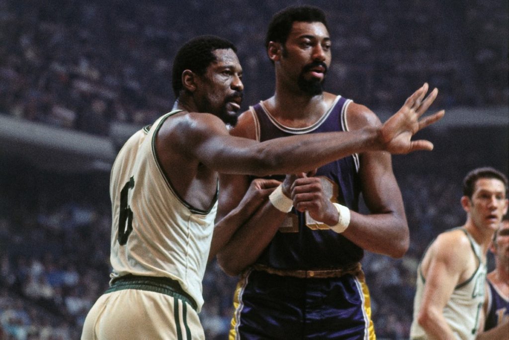 BOSTON - 1968:  Bill Russell #6 of the Boston Celtics defends against Wilt Chamberlain #13 of the Los Angeles Lakers during a game played in 1968 at the Boston Garden in Boston, Massachusetts. NOTE TO USER: User expressly acknowledges and agrees that, by downloading and or using this photograph, User is consenting to the terms and conditions of the Getty Images License Agreement. Mandatory Copyright Notice: Copyright 1968 NBAE (Photo by Dick Raphael/NBAE via Getty Images)