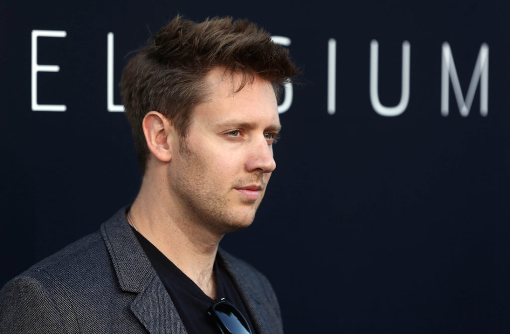 Writer and director Neill Blomkamp arrives at the world premiere of "Elysium" at the Regency Village Theater on Wednesday, Aug. 7, 2013 in Los Angeles. (Photo by Matt Sayles/Invision/AP)